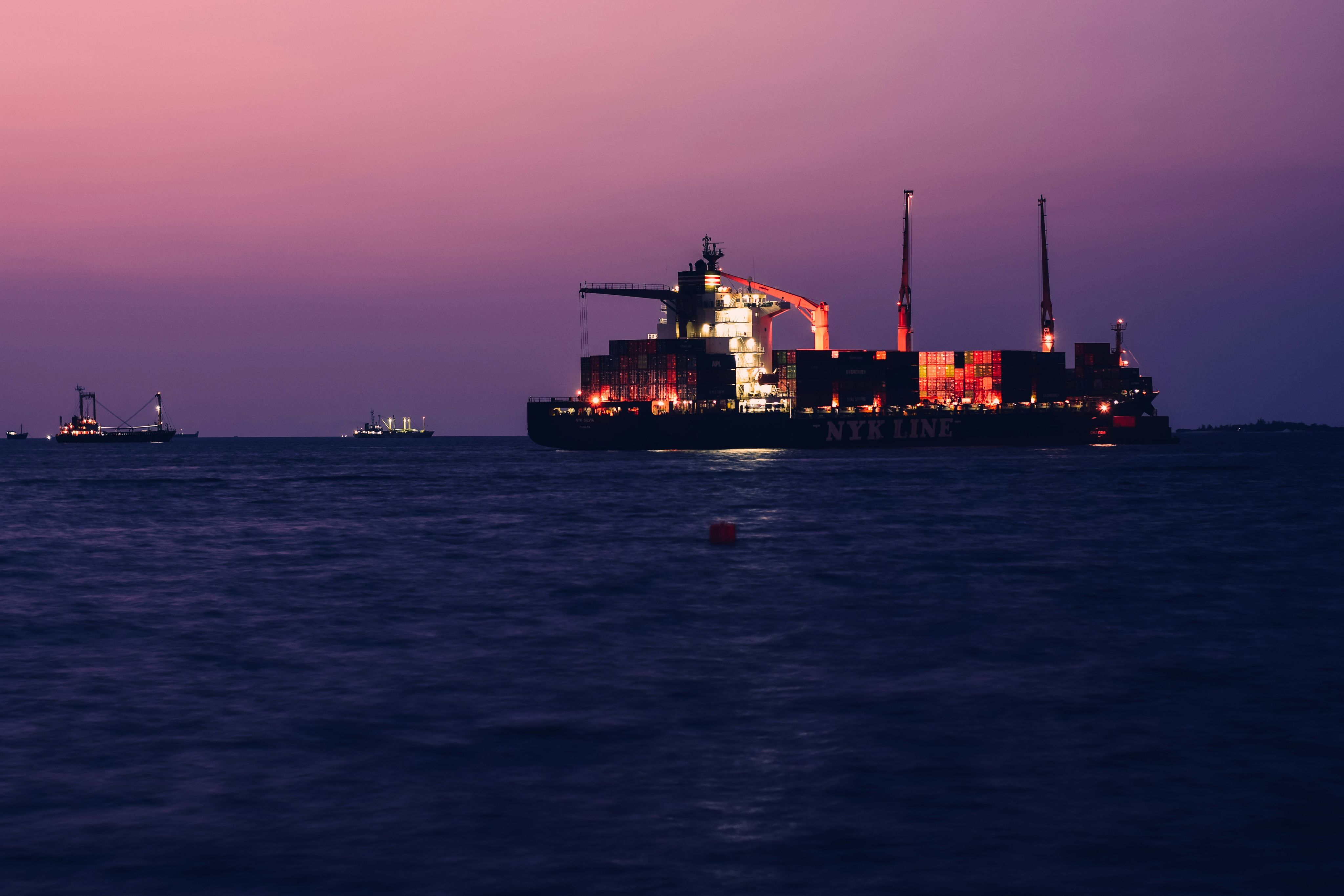 a large cargo ship in the middle of the ocean